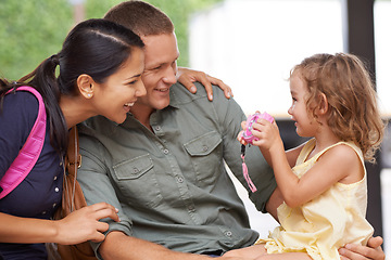 Image showing Camera, photography and happy family on a sofa with toy, love and bonding in their home together. Picture, photoshoot and girl child with parents in a living room for memory, moment or photo fun