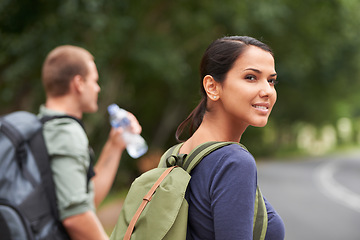 Image showing Couple, backpacking and nature trekking for adventure journey or drinking water in forest, travel or together. man, woman and environment in Australia for bonding relationship, fitness or walking