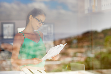 Image showing Business woman, window and review documents for project, glasses for reading with editor and fact check article. Information, analysis and news with paperwork, proofreading and productivity in office