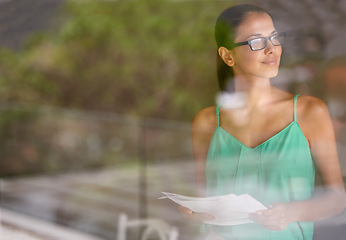 Image showing Woman, thinking at window and documents for review, glasses for reading with editor and fact check article. Inspiration, knowledge and ideas with paperwork, proofreading and productivity in office