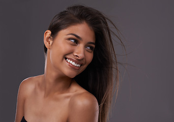 Image showing Woman, studio and haircare with happy beauty, Indian female person with luxury and salon treatment. Thinking of keratin blowout or styling for results and wellness, isolated and glowing model