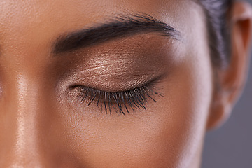 Image showing Woman, eyes and eyeshadow makeup as closeup of beauty cosmetics for skincare dermatology, mascara or healthy. Female person, eyebrow and wellness glow or closed for self care, extension or treatment