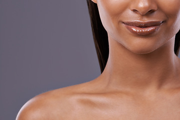 Image showing Closeup, lipstick and woman with skincare, cosmetics and dermatology on grey studio background. Person, model and girl with shine and glow with grooming routine and makeup with mouth, lips and mockup