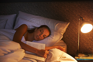 Image showing Woman, sleep and book in bed and light, dreaming female person or night lamp for story and novel. Relax, hobby and tired girl with fantasy or biography, literature or learning for peaceful rest