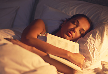 Image showing Woman, sleep and book in bed and resting, dreaming female person or night lamp for story and novel. Relax, hobby and tired girl with fantasy or biography, literature or learning for peace in room