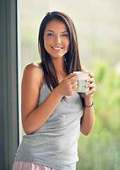 Image showing Woman, portrait and drinking coffee at window view with smile in apartment for holiday, weekend or vacation. Female person, face and caffeine beverage in London or calm in bedroom, resting or pyjamas