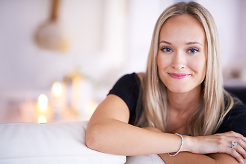 Image showing Portrait, relax and smile of woman on sofa in living room of home for free time, morning or weekend. Face, stress relief or wellness with happy young person in lounge of apartment for peace and quiet