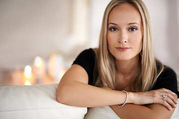 Image showing Portrait, serious woman and relax on couch, wellness and confidence of freelancer in living room. Face, pride and entrepreneur with candles in lounge, mindfulness and remote job with peace in house