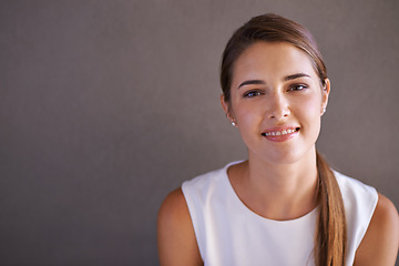 Image showing Portrait, happy woman or smile in studio professional and confident person by grey background. French female, designer and pride on face for career growth and positive attitude in creative job