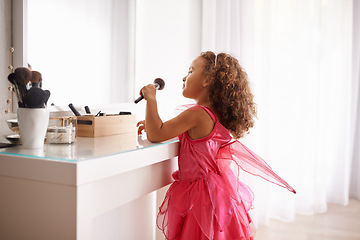 Image showing Child, brush and mirror with makeup for skincare, beauty or happiness with cosmetics or smile. Girl, grooming and reflection of a young kid in with foundation, space or blusher in the home or house