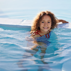 Image showing Child, girl and swimming with face, swimwear and blue summer sky for relax or smile. Kid, youth and sunshine with happiness, outdoor and play with curly hair and fun for sunny positivity or childhood