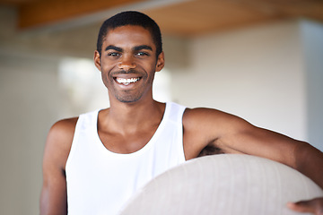 Image showing Portrait, fitness and ball with black man at gym, in tank top for health, wellness or workout. Exercise, training and vitality with happy young person in vest for challenge or performance routine