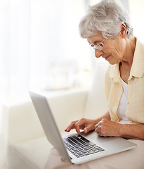 Image showing Senior woman, laptop and home planning for reading, typing or search an ebook on internet. Happy elderly person with computer for learning, website and online crossword game for sign up information