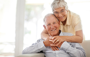 Image showing Couple, senior and hug or sofa in portrait, home and relax together for bonding and smile. Elderly people, embrace and care in marriage or relationship in retirement, loyalty and security on couch