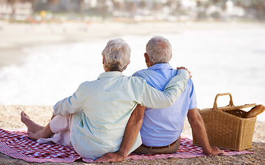 Image showing Elderly, couple and relax beach for picnic together for summer bonding or travel connection, outdoor or view. Old woman, man and back for vacation holiday at ocean in Hawaii for rest, peace or fun