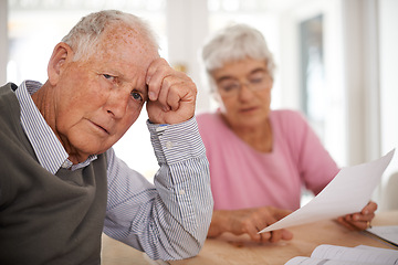 Image showing Senior, couple and documents for discussion with worry, finance conversation for will at home. Elderly, stress or paper work reading with anxiety and retired people, pensioners with tax bill at table