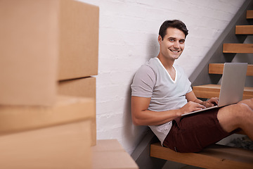 Image showing Portrait, boxes and man with laptop in home for property investment, real estate or mortgage of new apartment. Homeowner, computer and face of happy male person for relocation, growth or renovation