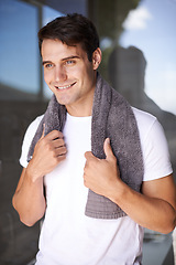 Image showing Happy man, towel and hygiene with satisfaction for grooming or morning freshness by window at home. Handsome, young male person with smile for cleanliness, masculine or health and wellness at house