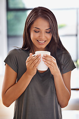 Image showing Woman, coffee and mug with kitchen, smile and morning for home routine. Person, cup and tea with house, beverage and aroma for relax and caffeine or taste cheerful to enjoy break with happiness