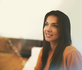 Image showing Woman, relax and thinking on couch in living room for wellness, comfort and smile in home. Happiness, lens flare and face of female person on sofa for calm, weekend off and peaceful day in apartment