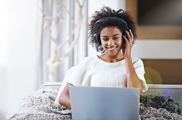 Image showing African, woman and laptop with smile, headphones and technology for video and music. Student, computer and internet for streaming, blog or email with connectivity and relaxation for wellness in house