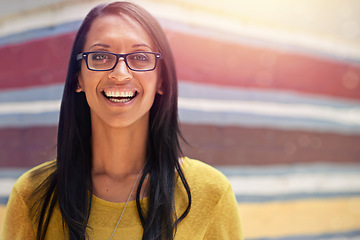 Image showing Woman, portrait and smile for eyewear outdoors, cool frame and proud of lens by wall background. Female person, prescription and designer glasses or style, optical health and happy or confidence