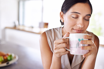 Image showing Woman, relax and smell coffee on kitchen or morning, enjoying and holding mug or cup. Female person, drinking tea or expresso for breakfast or energy at home, eyes closed and smile indoors or house