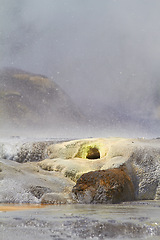 Image showing Sulphur spring, pools and water with mineral deposit, salt and natural benefits. Steam, gases or outdoor in New Zealand with rocky terrain, nature and fog or hot fountain of aqua from thermal stream