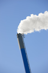 Image showing Chimney, smoke and sky for industrial outdoor in environment for pollution, waste and emission of smog and chemical in factory. Coal, energy and manufacturing with chemicals for ecology and climate