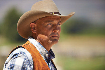 Image showing Cowboy, ranch and thinking in outdoor, sun and serious for wrangler and Texas farmer at stable. Mature man, wild west and summer in agriculture, hat and person with shirt in farm job and environment