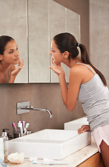 Image showing Bathroom, face in mirror and woman for skincare, beauty and wellness in morning routine. Health, dermatology and person in reflection for pimple, home or facial for cleaning, hygiene and grooming