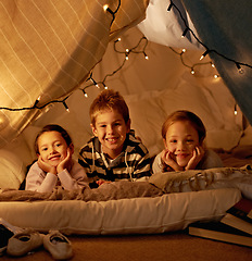 Image showing Kids, happy and playing in blanket fort with portrait for fantasy, bonding and fairy lights at night. Friends, children and face with smile for pajama party, sleepover and pillow tent with lighting