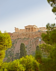Image showing Athens, location and holiday for trip, travel and outdoor in history landmark in Europe in summer. Medieval, outside and environment for scenic, bridge and stone monument in nature, tree and forest