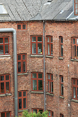 Image showing Town, building and apartment with vintage architecture for historic, classic and ancient design in England. Traditional cultural and structure with residential property in small neighborhood