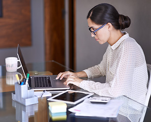Image showing Businesswoman, working and office with laptop, desk and online in corporate career. Technology, tablet and computer for financial advisor, consultant and paperwork with calculator for budget research