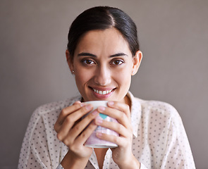 Image showing Woman, studio and smile with coffee, portrait and cup for happiness and break. Person, mug and espresso with confidence, caffeine and relax for taste or calm with positivity and rest with beverage