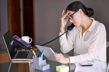 Image showing Businesswoman, phone call and stressed in office, desk and on landline with client. Technology, computer and tablet touch screen for financial advisor, conversation and communication on budget
