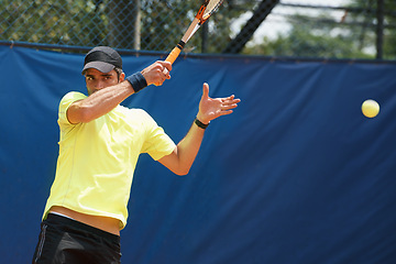 Image showing Man, serve and playing in competition on tennis court, athlete and racket or ball for professional match. Fitness, outdoor and person in training for tournament and skill of champion player in game