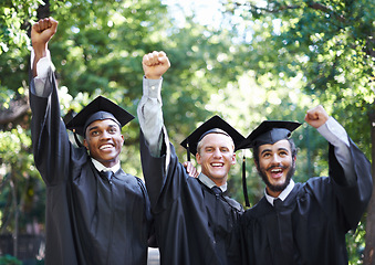 Image showing Excited, students and portrait at graduation with fist, success and celebration of men outdoor with a smile. Fist pump, yes and education event on campus with diversity and college degree achievement