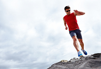 Image showing Man, running and beach for fitness, health and wellness in activewear and sunglasses. Athlete male person, jog and seaside for sport, train and nature workout or exercise for cardio outdoor mockup