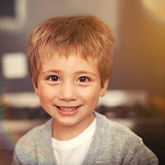 Image showing Portrait, boy and smile for happiness, vacation and resting in home on weekend. Children, lens flare and face of kid for childhood development, growth and positive fun on school holiday in apartment