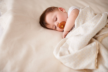 Image showing Baby, sleeping and tired from nap with relax child and nursery with peace in a bed with blanket. Morning, toddler and kid with dream of infant with youth development from rest in bedroom with newborn