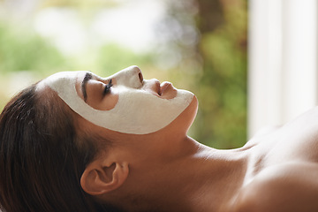 Image showing Skincare, cosmetic and woman with face mask at spa for glow, wellness and beauty routine with peace. Natural, pamper and female person relaxing for clay facial dermatology treatment at salon.