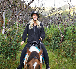 Image showing Horse, riding and portrait of woman on adventure in vacation or holiday journey on path in nature. Training, animal and person travel on trail with pet in countryside, woods and summer with happiness