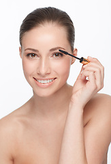 Image showing Woman, portrait and skincare for beauty, mascara and makeup with lashes and cosmetology on white background. Face, wand for eyelash extension and skin, glow or shine with cosmetics product in studio