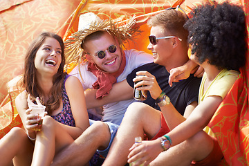 Image showing Happy friends, laughing and camping in tent for funny joke, comedy or humor at outdoor festival. Friendship, young group or people smile enjoying fun holiday, drinks or event for bonding on campsite