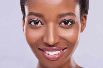 Image showing Dermatology, cosmetics and portrait of black woman with smile, glowing skin and natural spa makeup in studio. Happy, beauty and luxury skincare with healthy face of girl isolated on purple background