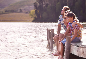 Image showing Happy family, lake and nature for vacation, holiday and travel in cape town, countryside and dock. Father, mom and children with water, forest and summer for happiness, together and barefoot