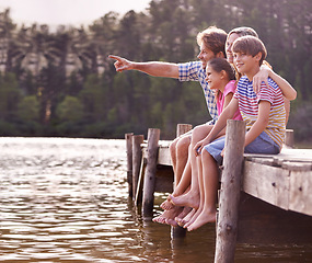 Image showing Happy family, lake and nature for travel, holiday and vacation in cape town, countryside and dock. Father, mom and children with water, forest and summer for happiness, together and barefoot