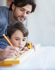 Image showing Father, son and woodwork or teaching construction with measuring tape or development, bonding or home repairs. Male person, child and parenting for carpenter learning or furniture, lesson or building